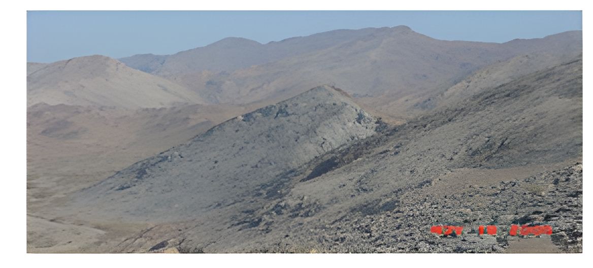 Desert mountain outcrop surveyed during reconnaissance