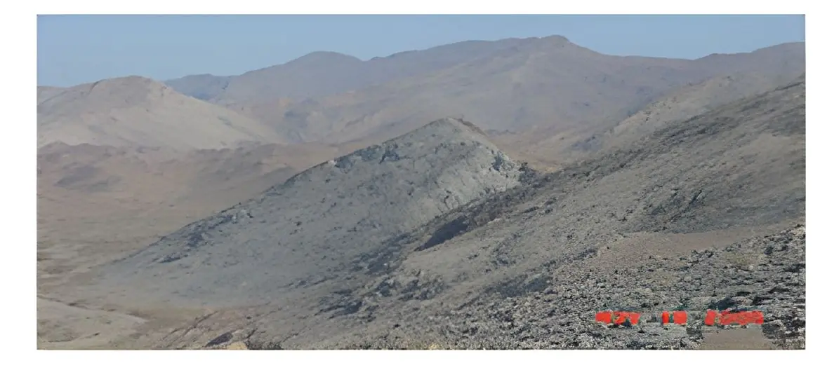 Desert mountain outcrop surveyed during reconnaissance